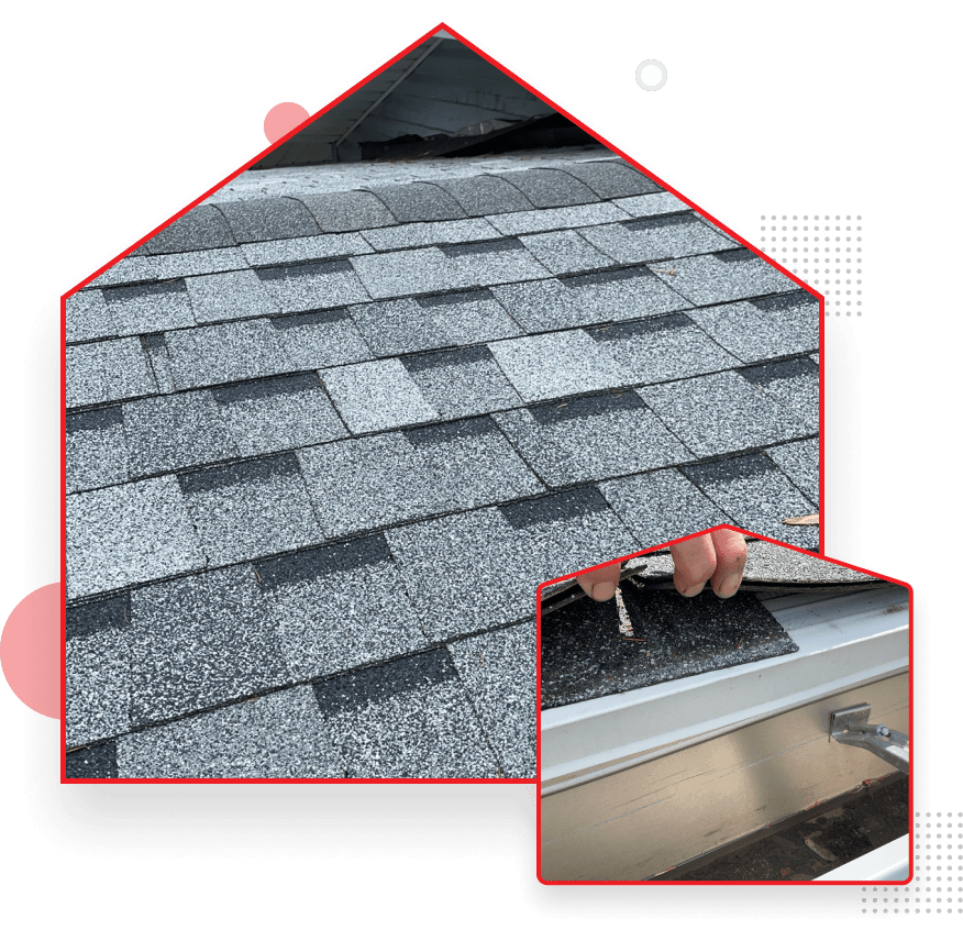 Damaged asphalt roof shingles with missing sections and exposed underlayment