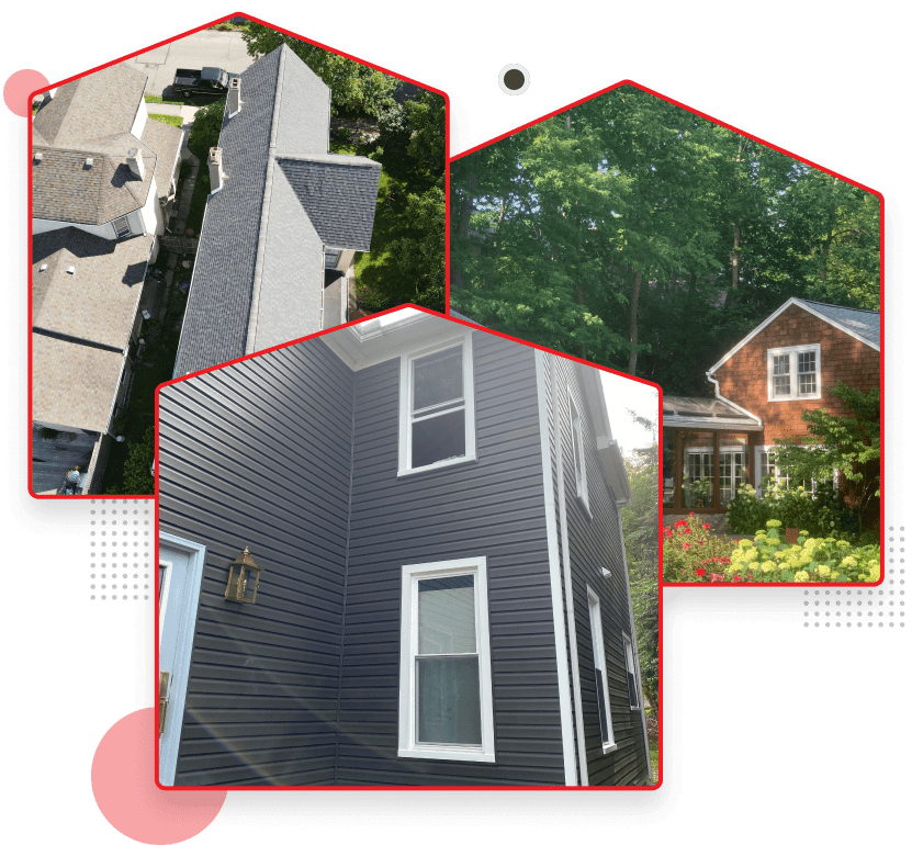 Residential home exterior renovation showing dark gray siding and white windows