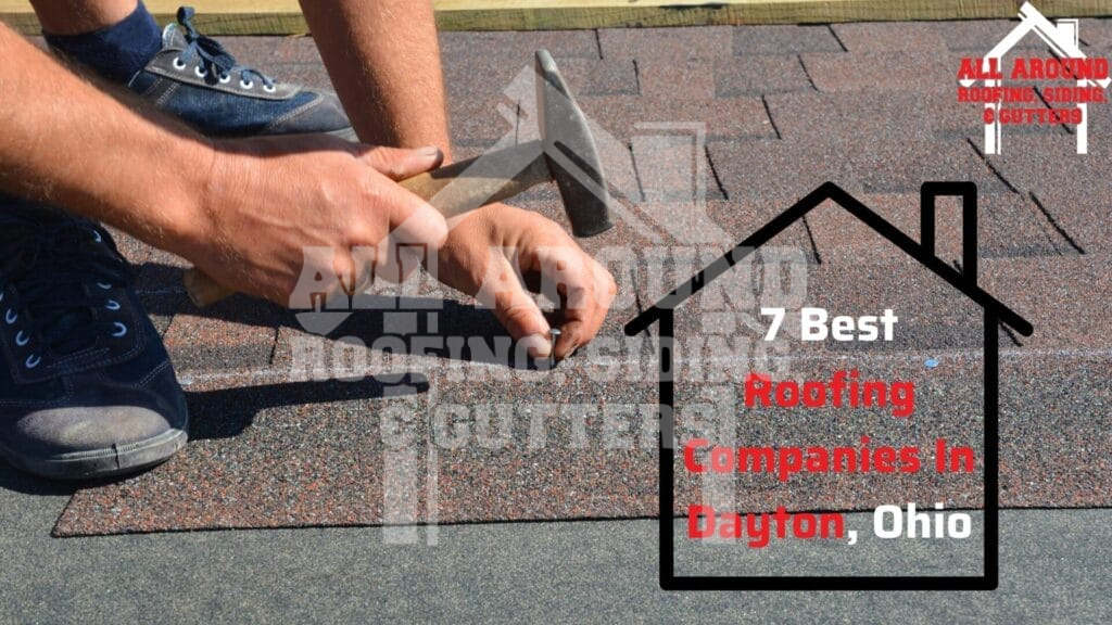 Professional roofer installing asphalt shingles on residential roof in dayton