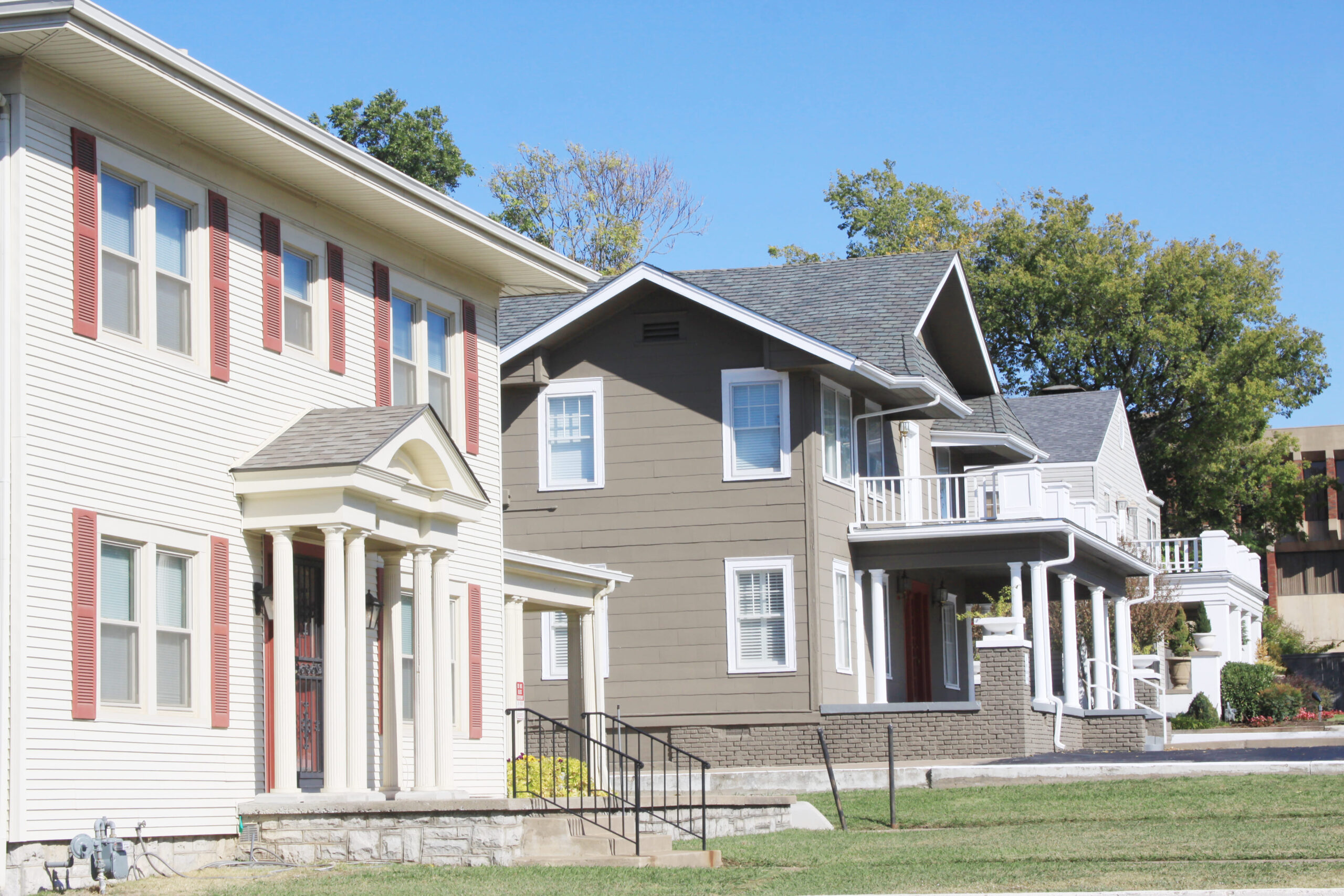 Two-story residential homes with front porches and traditional architecture