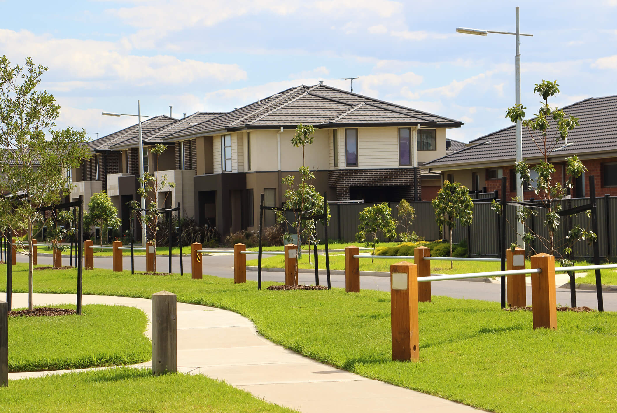 Modern suburban neighborhood with contemporary houses and landscaped walkways